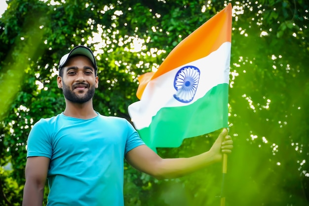 Young indian man with indian flag