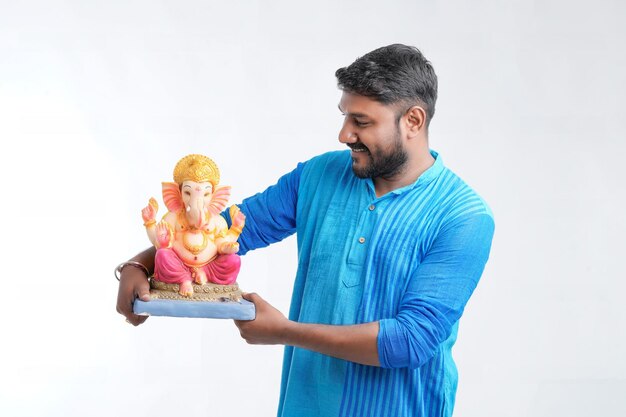 Young Indian man with Lord Ganesha Celebrating Ganesha festival