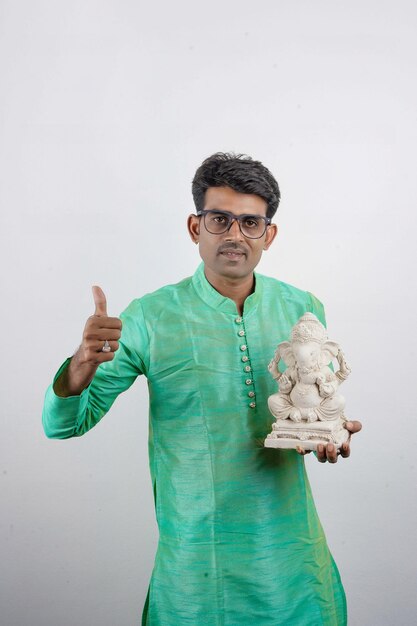 Young Indian man with Lord Ganesha Celebrating Ganesha festival