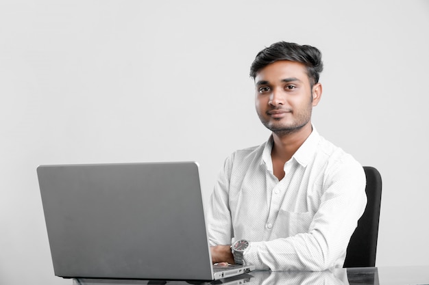 young indian man working at office