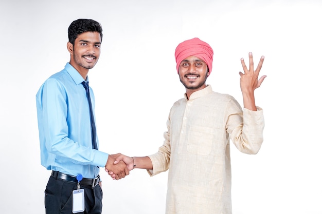 Young indian officer with farmer on white background.