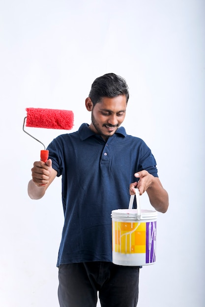 Young indian Painter man over white background.