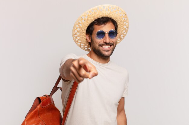 Young indian traveler man pointing or showing