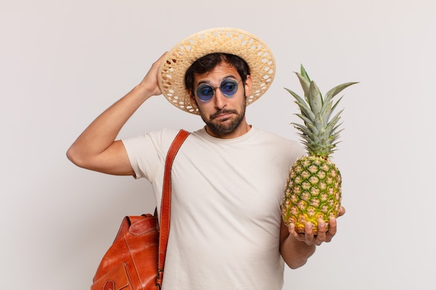 Young indian traveler man thinking expression