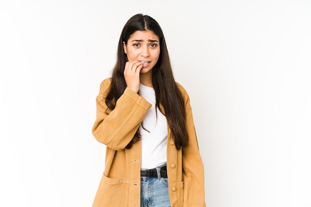 Young indian woman biting fingernails, nervous and very anxious.