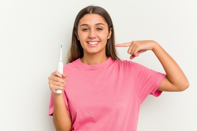 Photo young indian woman brushing teeth isolated on white background