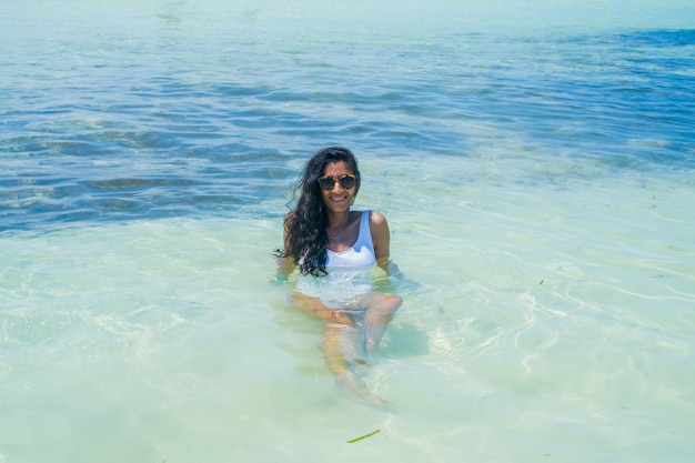 Young indian woman happy in the beach