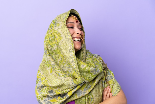 Young Indian woman over isolated wall