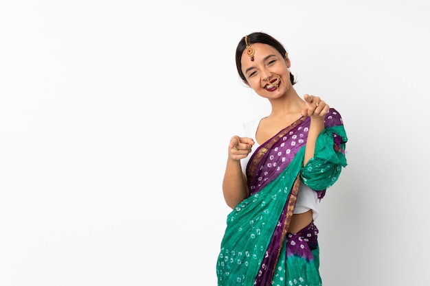 Young indian woman isolated on white pointing front with happy expression