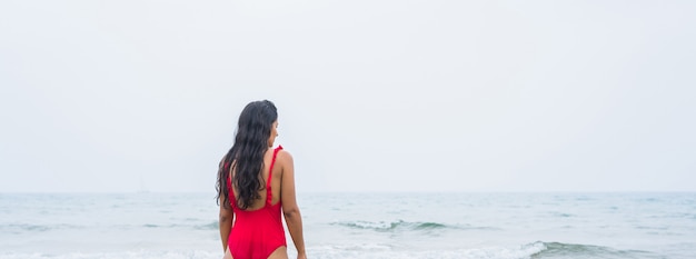 Young indian woman looking away on the sea