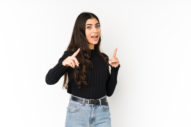 Young indian woman pointing to front with fingers.