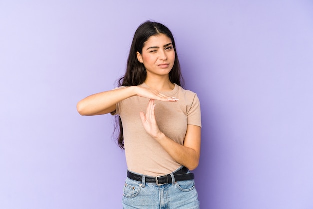 Young indian woman showing a timeout gesture.