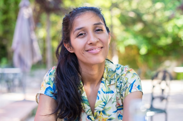 Young indian woman smiling on a sunny day