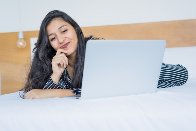 Young indian woman using the laptop