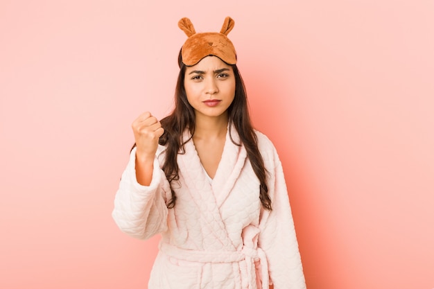 Young indian woman wearing a pajamas and sleep mask