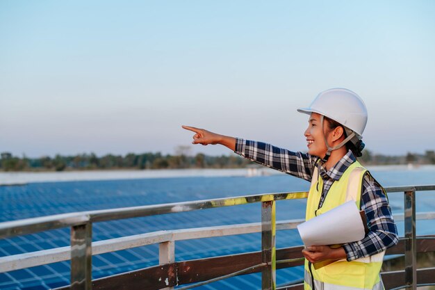 Young inspecotor female checking operation photovoltaic solar panel