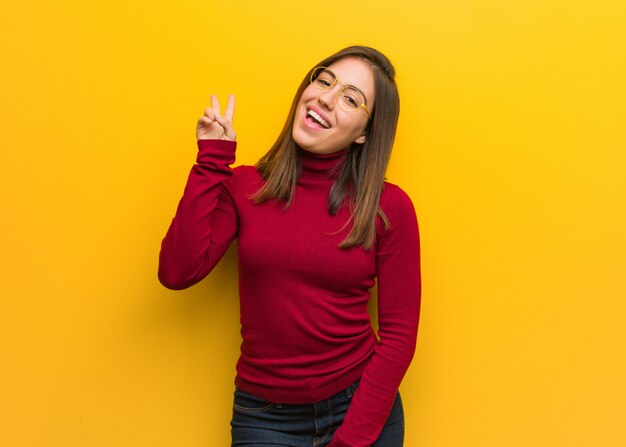 Young intellectual woman doing a gesture of victory