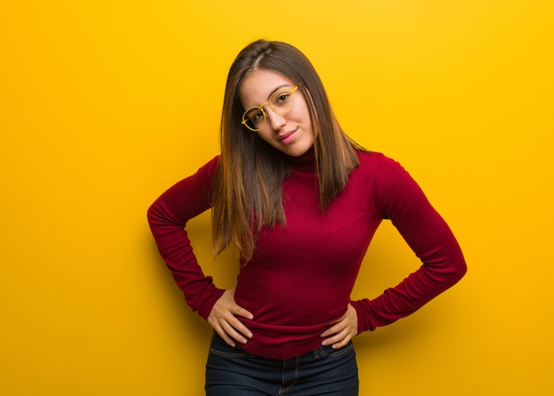 Young intellectual woman scolding someone very angry