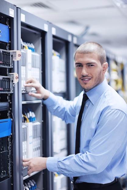 young it engineer in datacenter server room