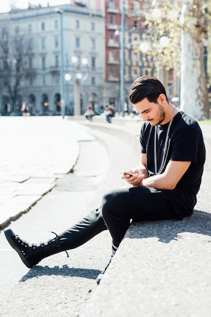 Young italian boy using smartphone