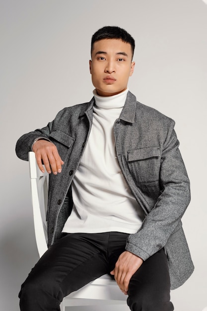 Young japanese man portrait on chair