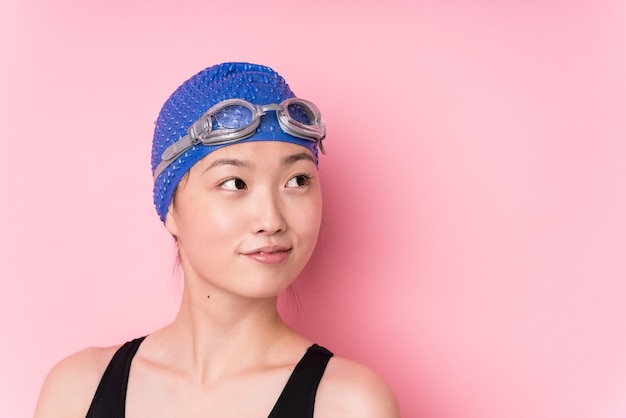 Young japanese swimmer woman face closeup isolated