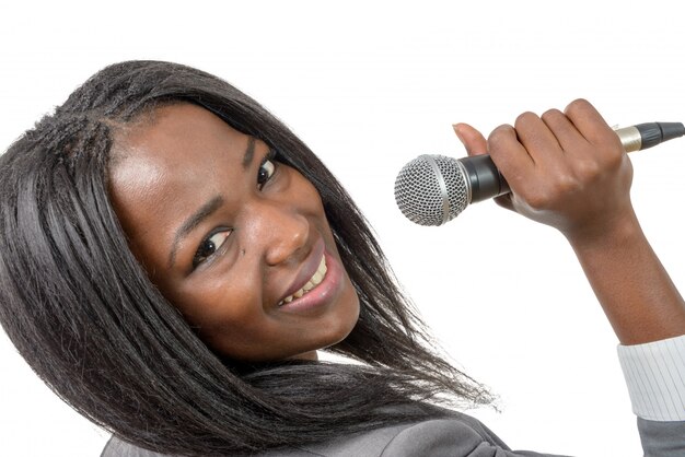 Young journalist with a microphone 