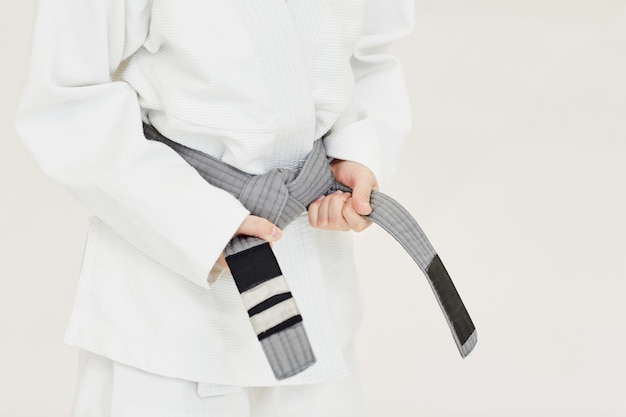 Young judoist getting a belt