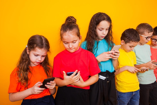 Young kids playing game on mobile phone