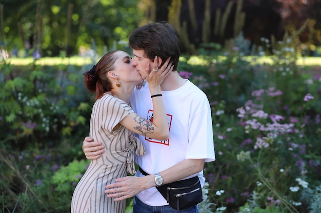 young kissing couple in the park