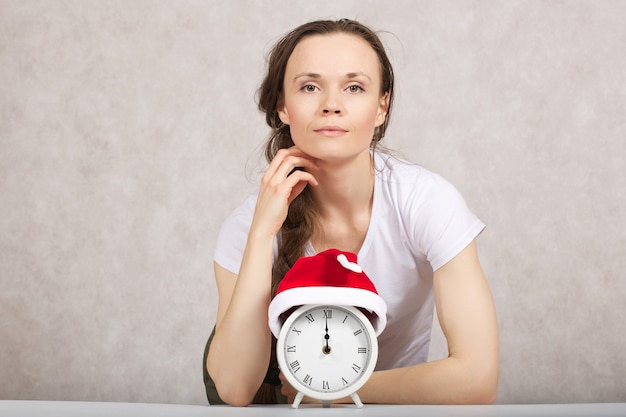 Young lady between 30 and 40 years in Santa Claus hat