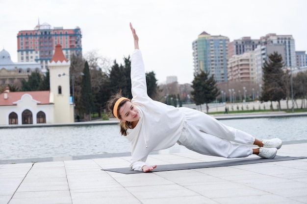 Young lady doing her exercises at the park High quality photo