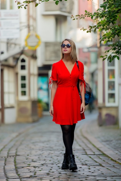 Young lady in dress on medieval street of Bremen