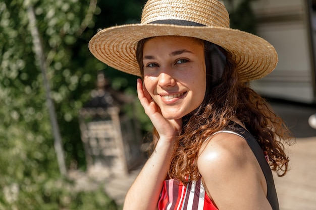 A young lady enjoys summer vacation in a campvan