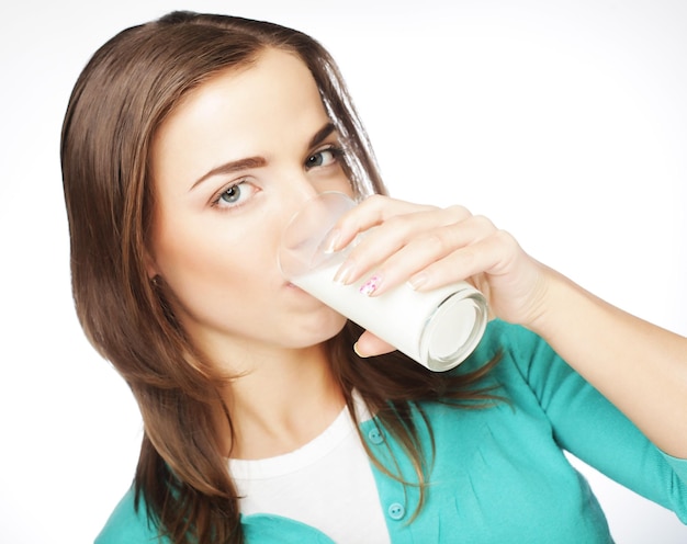 Young lady having a glass of milk