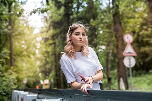 Young lady walks in the woods and have a great time outdoors. summer