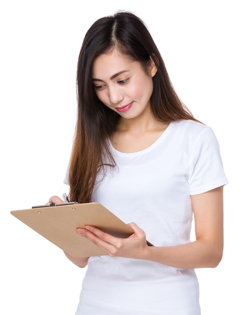 Young lady write on clipboard