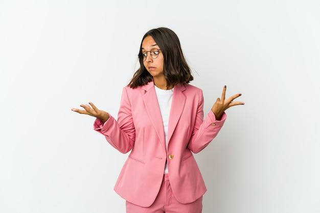 Young latin business woman isolated on white background feeling energetic and comfortable, rubbing hands confident.