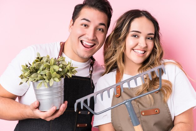 Young latin gardeners in love couple