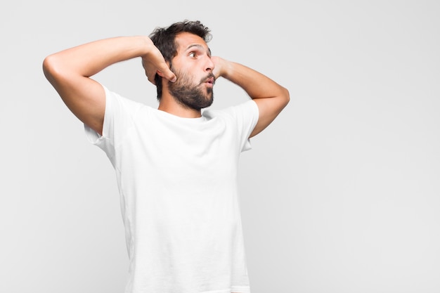 Young latin handsome man in t-shirt isolated