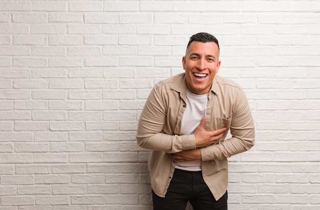 Young latin man laughing and having fun