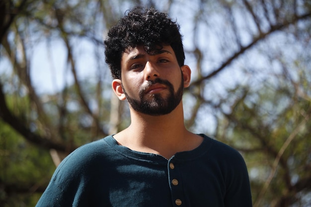 A young latin man in nature