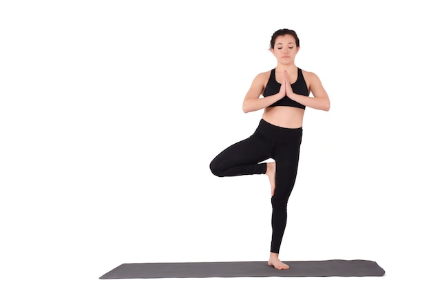 Young latin woman doing yoga pose.