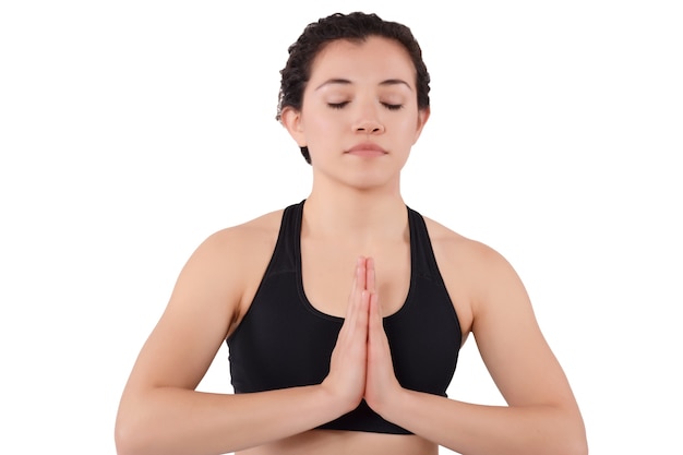 Young latin woman doing yoga pose.