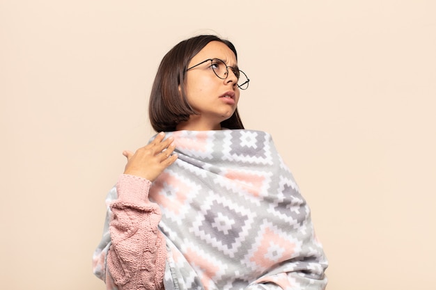 Young latin woman feeling stressed, anxious, tired and frustrated, pulling shirt neck, looking frustrated with problem