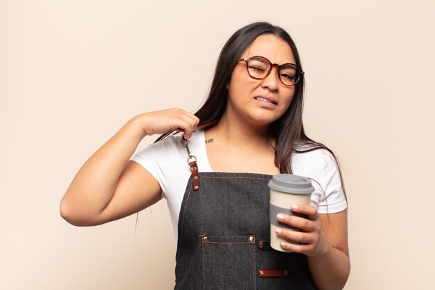 Young latin woman feeling stressed, anxious, tired and frustrated, pulling shirt neck, looking frustrated with problem