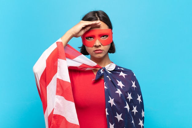 Young latin woman greeting the camera with a military salute in an act of honor and patriotism