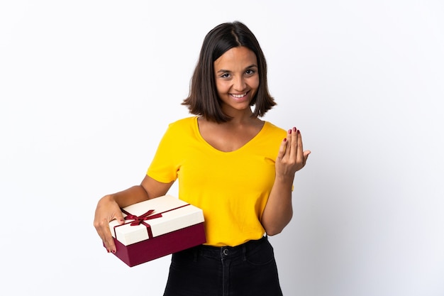 Young latin woman holding a gift