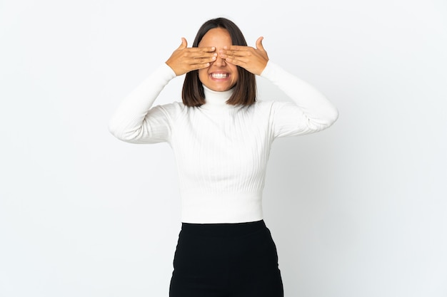 Young latin woman isolated covering eyes by hands and smiling