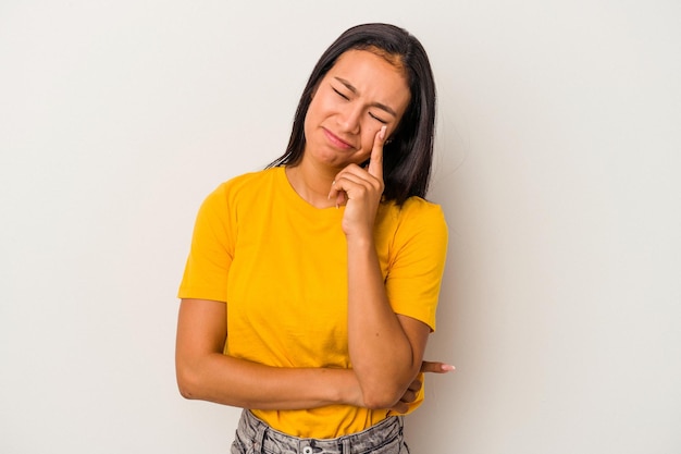 Young latin woman isolated on white background  crying unhappy with something agony and confusion concept